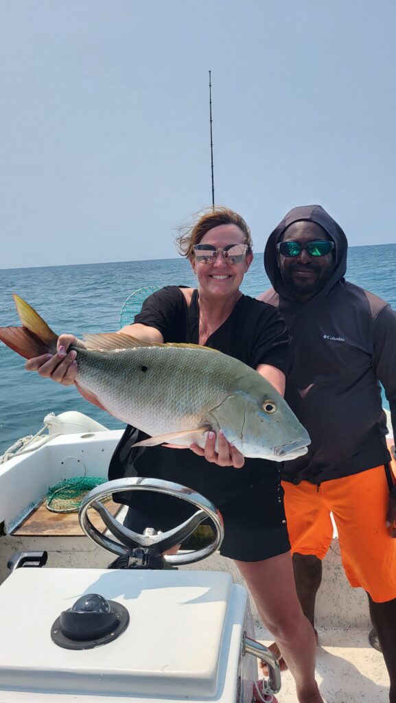Large snapper catch on private reef fishing charter in San Pedro, Belize with fish 101 Belize tours.