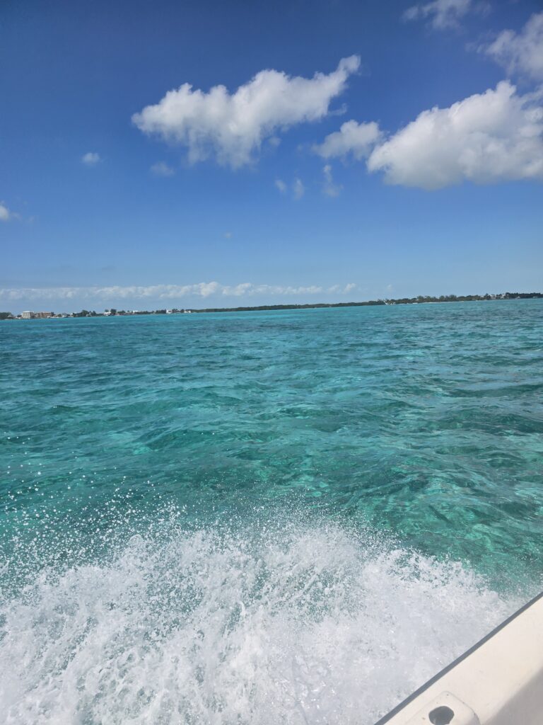 "Fast boat wake on the crystal clear turquoise waters of San Pedro Belize."